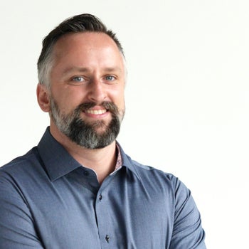 Portrait of Derek Mengar, Realtor.