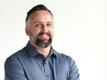 Portrait of Derek Mengar, Realtor